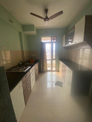 Kitchen in 2 BHK Apartment at Hiranandani Estate Queens, Ghodbunder Road – for Rent