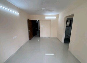 Living Room in 1 BHK Apartment at Ami Zarna, Malad West – for Sale