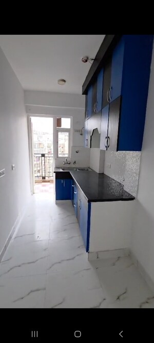 Kitchen in 3 BHK Apartment at Casa Woodstock, Sector 16c Greater Noida – for Sale