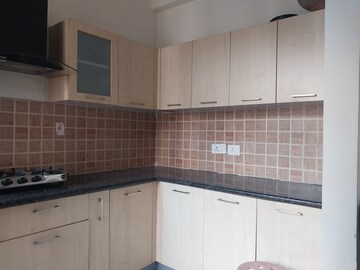 Kitchen in 3 BHK Apartment at Mahagun Mywoods, Sector 16c Greater Noida – for Rent