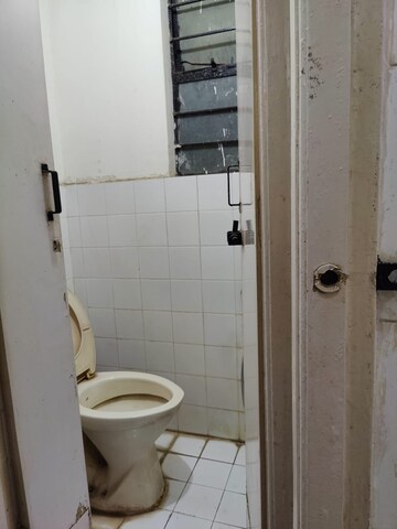 Bathroom in 2 BHK Apartment at Guru Ganesh Nagar Society, Kothrud – for Sale
