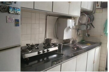 Kitchen in 2 BHK Apartment at Mangal Orchid Chs, Andheri West – for Rent