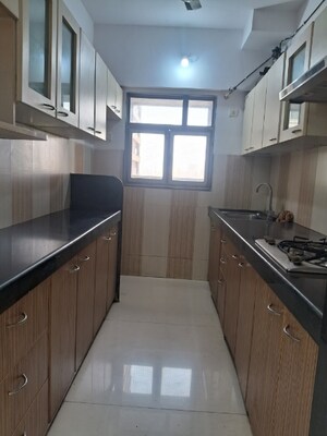 Kitchen in 2 BHK Apartment at Girnar Heights, Bhakti Park – for Rent