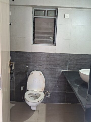 Bathroom in 2 BHK Apartment at Girnar Heights, Bhakti Park – for Rent