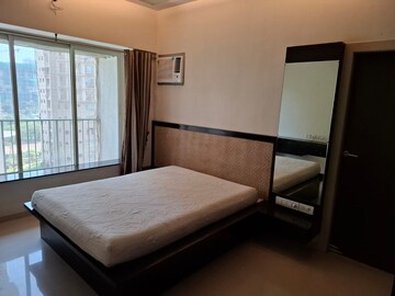Bedroom in 2 BHK Apartment at Rustomjee OZone, Goregaon West – for Rent