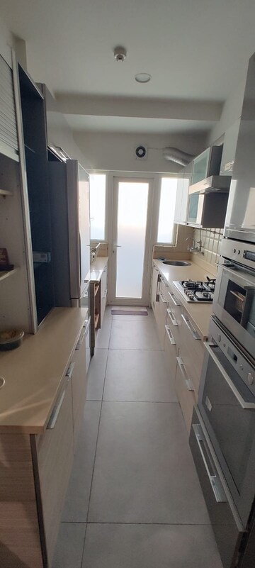 Kitchen in 3.5 BHK Apartment at Elite Golf Green, Sector 79 – for Rent