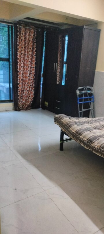 Living Room in 1 BHK Apartment at Parth CHS, Kharghar Sector 13 – for Sale