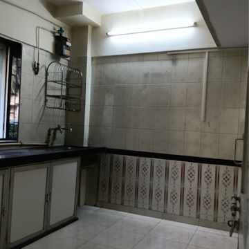 Kitchen in 1 RK Apartment at Railwaymens Apna Ghar CHS, Parsi Colony – for Rent