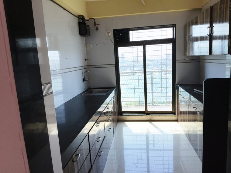 Kitchen, blue-kites-chs-ltd 3 Bedroom 1309 Sq.Ft. Apartment In Kopar Khairane Navi Mumbai 9303350