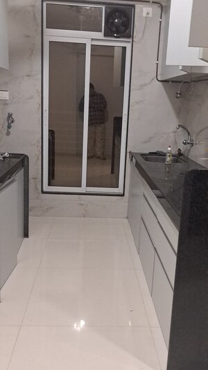 Kitchen in 3 BHK Apartment at Krishna Leela CHS Goregaon, Goregaon West – for Rent