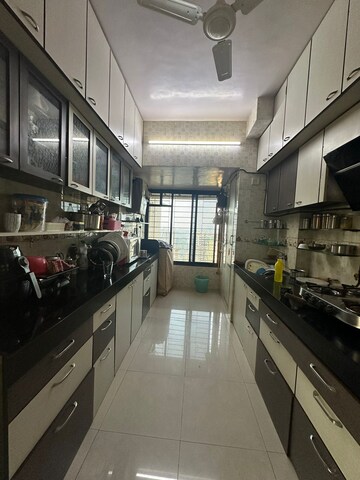 Kitchen in 2 BHK Apartment at Maharaja Retreat CHS, Goregaon East – for Rent