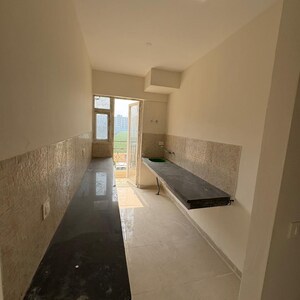 Kitchen in 2.5 BHK Apartment at Signature The Millennia 2, Garoli Kalan – for Rent