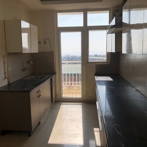 Kitchen in 3 BHK Builder Floor at Aman Luxury Apartments, Sahastradhara Road – for Rent
