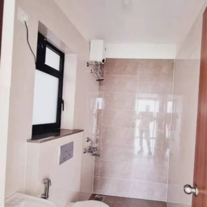 Bathroom in 1 BHK Apartment at Duville Riverdale Suites, Santipur – for Sale