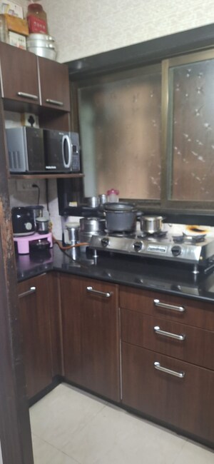 Kitchen in 1.5 BHK Apartment at Chamunda Heritage, Andheri East – for Sale