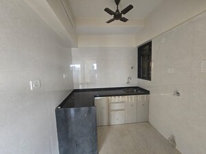 Kitchen in 2 BHK Apartment at Rajesh Raj Infinia, Malad West – for Rent