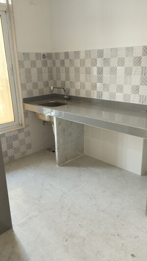 Kitchen in 2 BHK Apartment at ISD Maple Heights, Agripada – for Sale