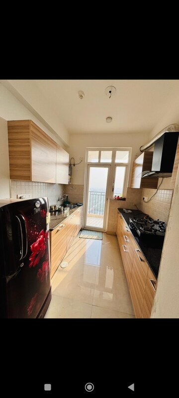 Kitchen in 2.5 BHK Apartment at ATS Happy Trails, Sector 10 Greater Noida – for Rent