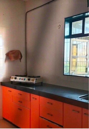 Kitchen in 3 BHK Apartment at Dedhia Platinum, Waghbil – for Rent