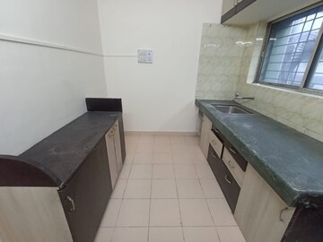Kitchen in 2 BHK Apartment at Kapare Heights, Anand Nagar – for Rent