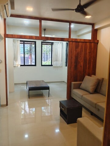 Living Room in 1 BHK Apartment at Khar West – for Rent
