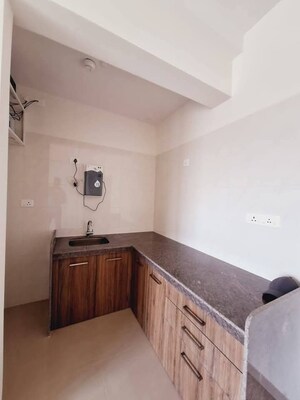 Kitchen in 1 BHK Apartment at Duville Riverdale Heights, Kharadi – for Rent