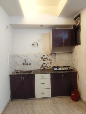 Kitchen in 1 BHK Apartment at Chattarpur – for Sale