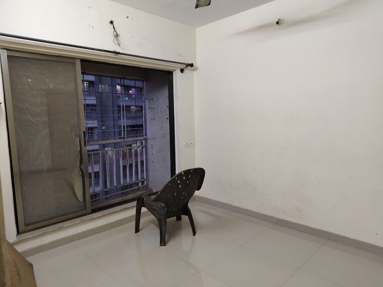 Living Room, unique-poonam-estate-cluster-2 2 Bedroom 674 Sq.Ft. Apartment In Mira Road Thane 9308477