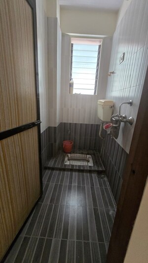 Attached Bathroom in 1 BHK Apartment at JS Bal Ganesh Tower, Naupada – for Sale