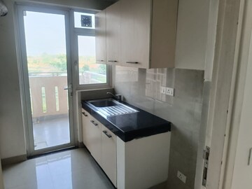 Kitchen in 4 BHK Builder Floor at Adani Samsara Vilasa, Sector 63 – for Sale