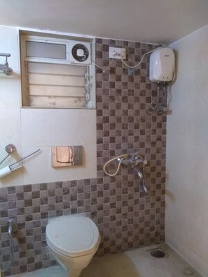 Bathroom in 2 BHK Apartment at Unique Poonam Estate Cluster 2, Mira Road – for Rent