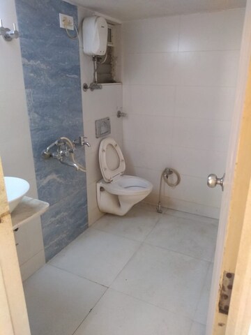 Bathroom in 2 BHK Apartment at Unique Poonam Estate Cluster 2, Mira Road – for Rent