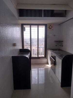 Kitchen in 2 BHK Apartment at Unique Poonam Estate Cluster 2, Mira Road – for Sale