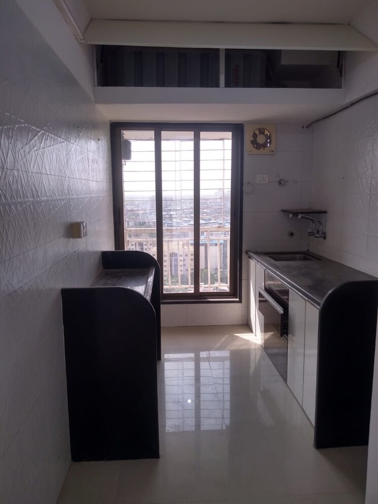 Kitchen, unique-poonam-estate-cluster-2 2 Bedroom 674 Sq.Ft. Apartment In Mira Road Thane 9310375