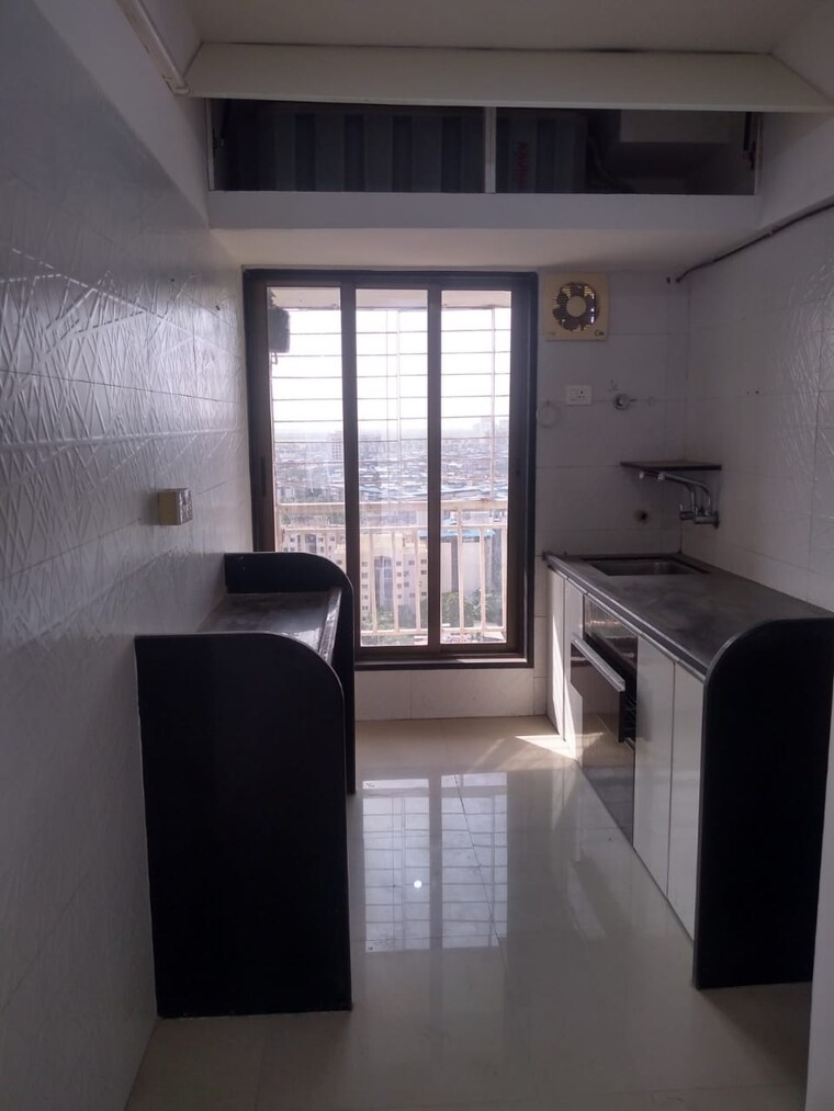 Kitchen, unique-poonam-estate-cluster-2 2 Bedroom 674 Sq.Ft. Apartment In Mira Road Thane 9310375