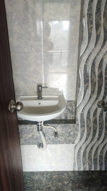 Bathroom in 1 BHK Apartment at Man Opus, Mira Road – for Sale