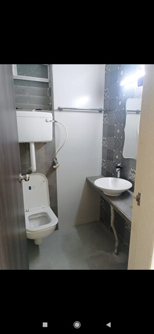 Bathroom in 3 BHK Apartment at Unique Poonam Estate Cluster 3, Mira Road – for Rent