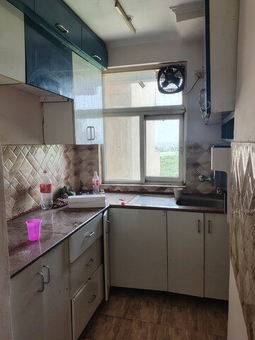 Kitchen in 2.5 BHK Apartment at Amrapali Leisure Park, Amrapali Leisure Valley – for Rent