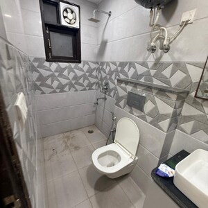 Bathroom in 2 BHK Apartment at Palm Residency Chhatarpur, Rajpur Khurd Extension – for Rent