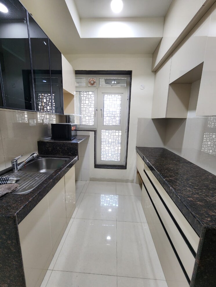 Kitchen, l-t-seawoods-residences-phase-1-part-a 2 Bedroom 825 Sq.Ft. Apartment In Seawoods Navi Mumbai 9311246