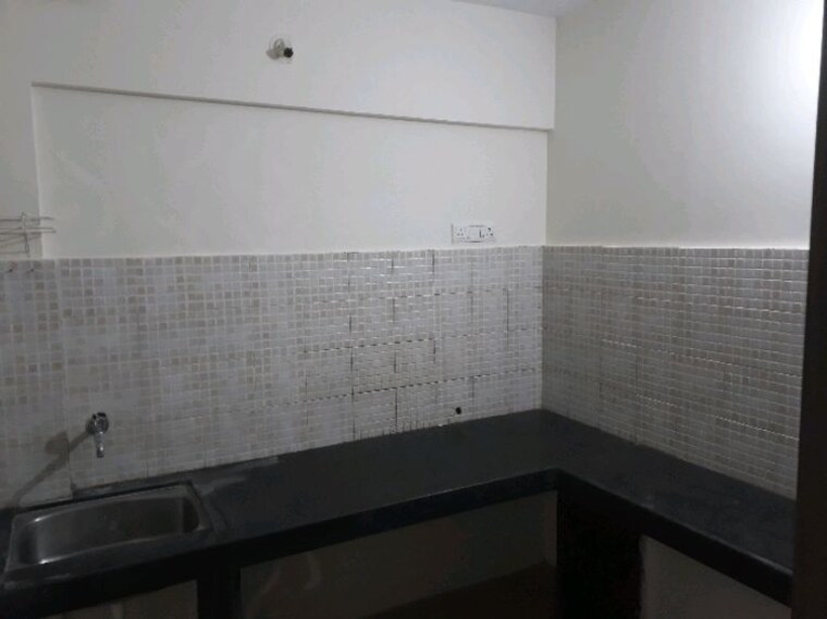 Kitchen, jalan-aura-county-pune 1 Bedroom 550 Sq.Ft. Apartment In Wagholi Pune 9312076