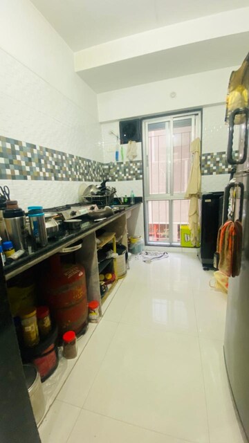 Kitchen in 1 BHK Apartment at Neel Sidhi Infinity, New Panvel – for Rent