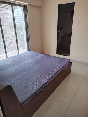 Bedroom in 2 BHK Apartment at Abhishek Trimurti Arcade, Karanjade – for Rent