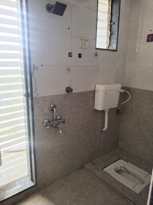 Bathroom in 2 BHK Apartment at Abhishek Trimurti Arcade, Karanjade – for Rent