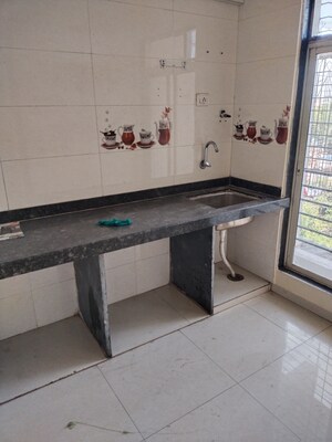 Kitchen in 2 BHK Apartment at Abhishek Trimurti Arcade, Karanjade – for Rent