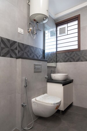 Bathroom in 4 BHK Builder Floor at Palm Residency Chhatarpur, Chattarpur – for Rent