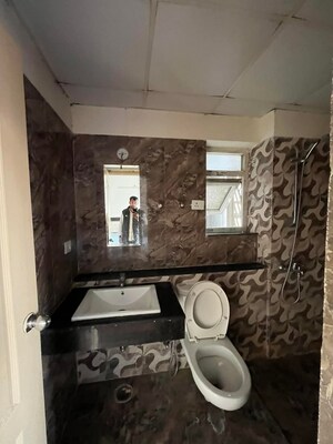 Bathroom in 2 BHK Apartment at Shri Radha Sky Gardens, Sector 16b Greater Noida – for Rent