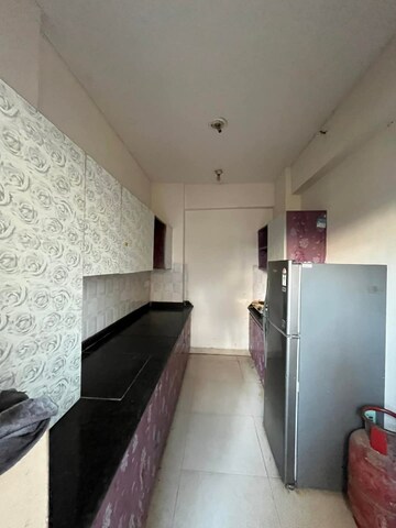 Kitchen in 2 BHK Apartment at Shri Radha Sky Gardens, Sector 16b Greater Noida – for Rent