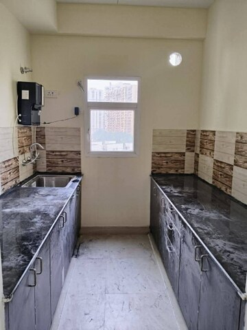 Kitchen in 2 BHK Apartment at BSB Vaibhav Heritage Height, Sector 16 Greater Noida – for Rent