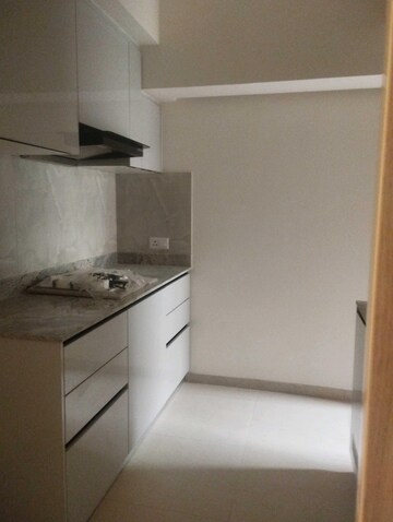 Kitchen in 3 BHK Apartment at DLF Gardencity Enclave, Sector 93 – for Sale